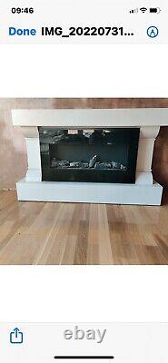 Electric fire with remote control and surround hardly used Excellent condition